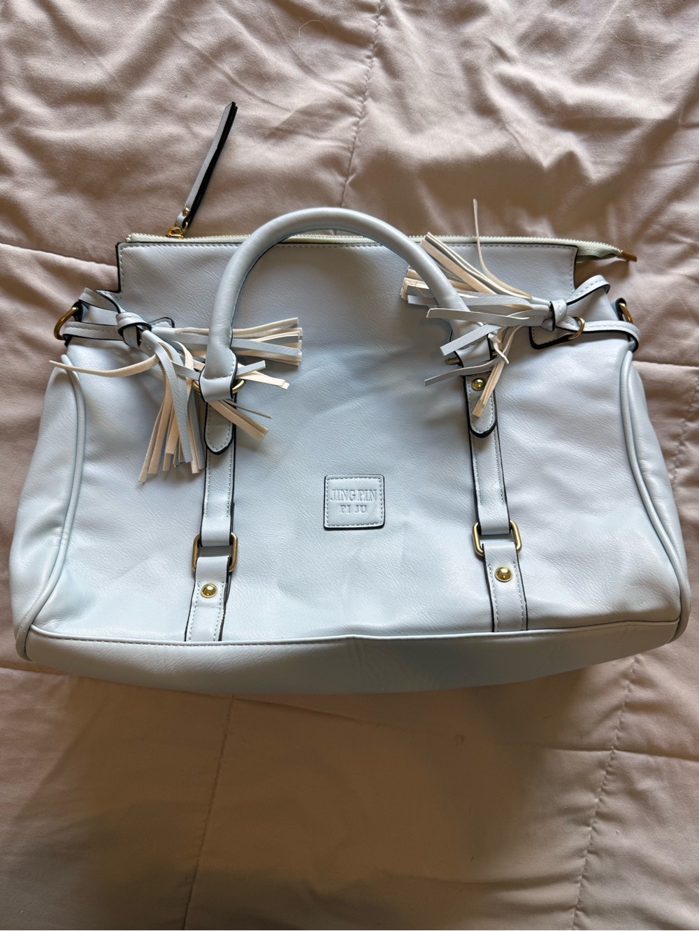 Light Blue Handbag with Tassel Accents